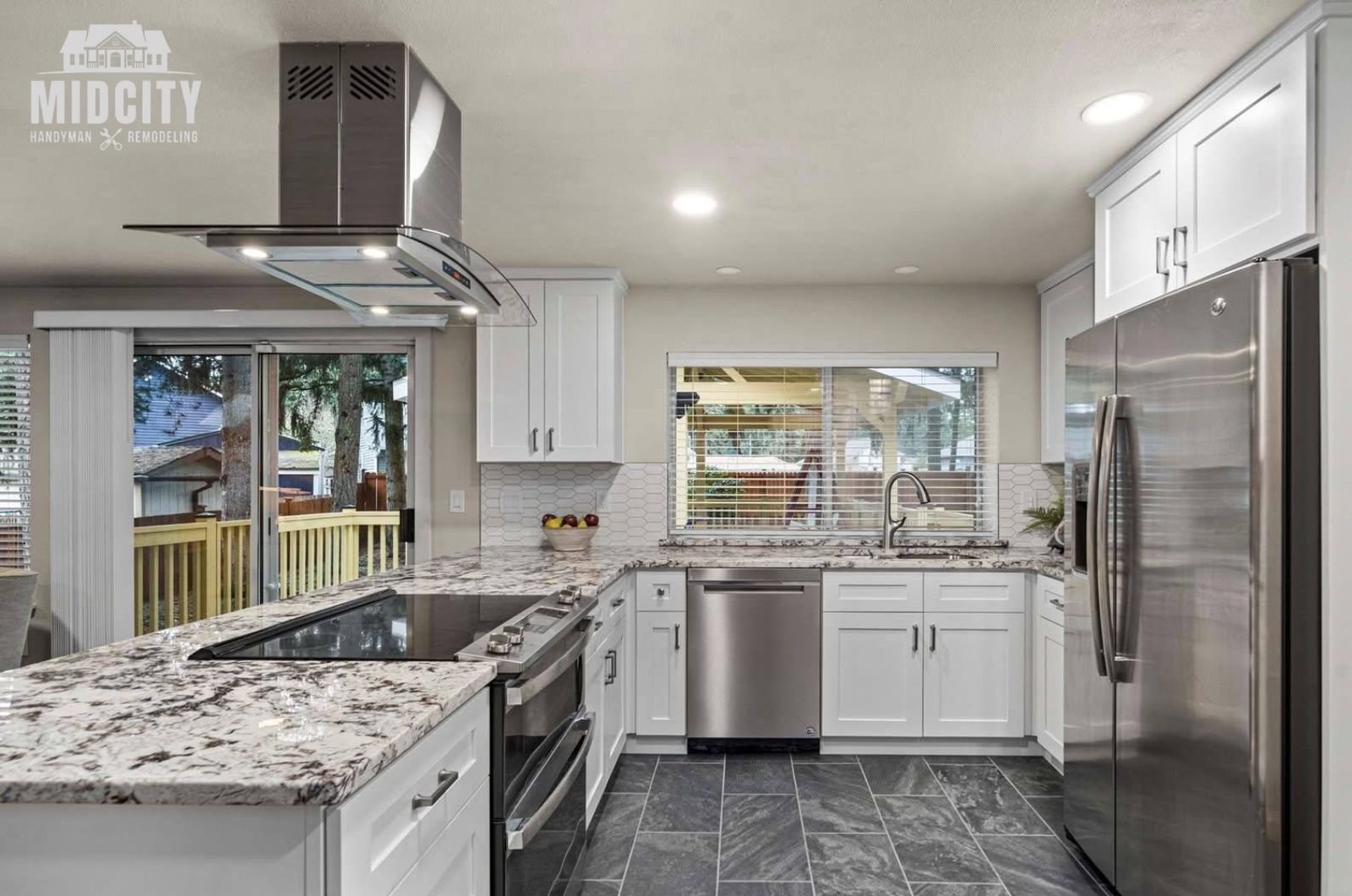 Kitchen remodel with white cabinetry, tile backsplash and under cabinet lighting